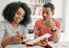 A couple looking at paperwork together